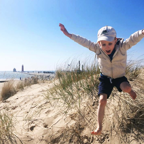 Young Boy Dune Jumping at Grand Haven State Park