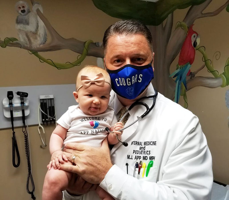 Dr App Internal Medicine and Pediatrics of West Michigan with cute baby patient