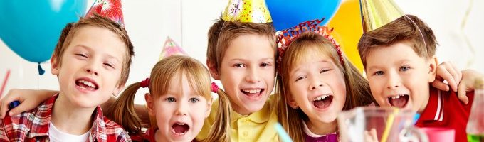 Group of adorable kids having fun at birthday party