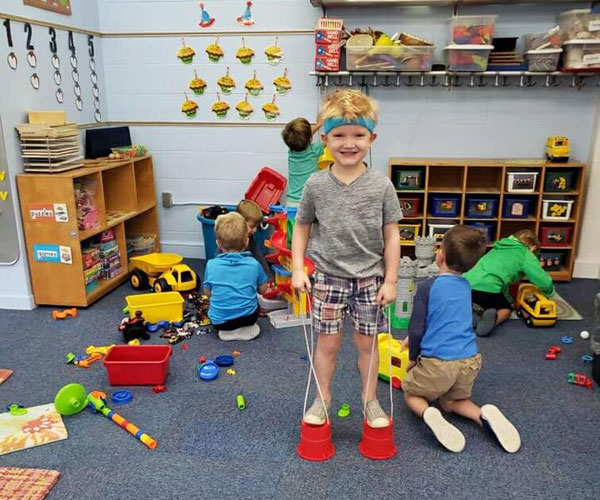 boy playing dress up at mayflower preschool