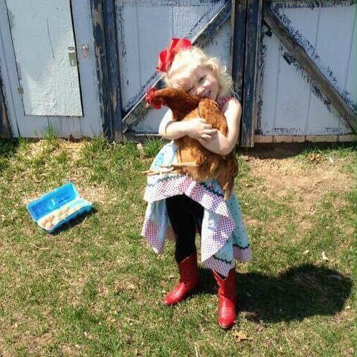 Little Cowgirl with chicken