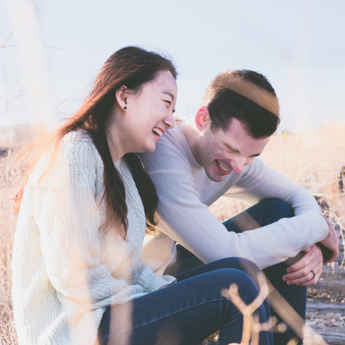 Mystery Date Night – Sitting Laughing Couple