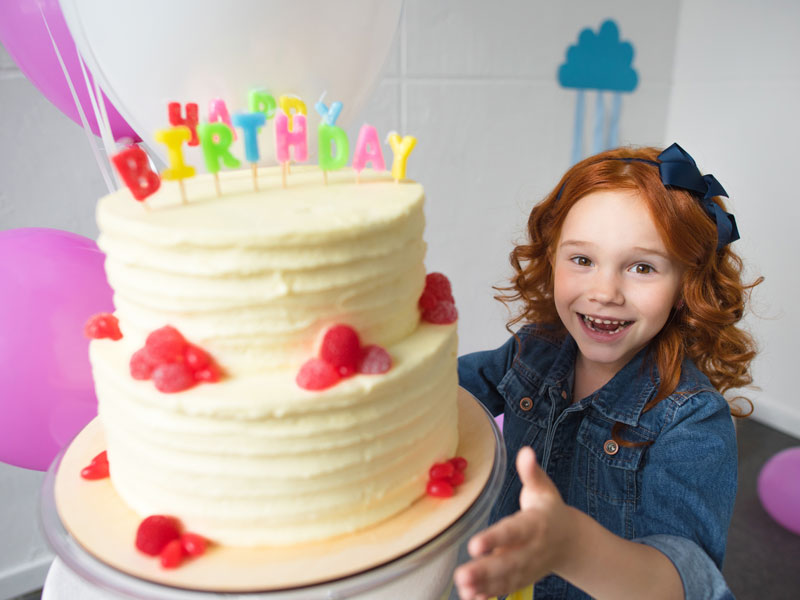 Happy girl with Birthday Cake Grand Rapids