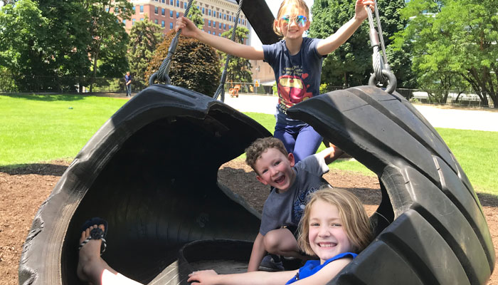 Kids on tire swing in Grand Rapids
