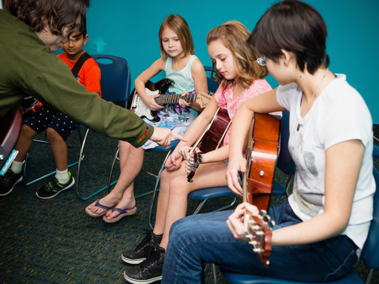 Academy of Music kids learning group guitar