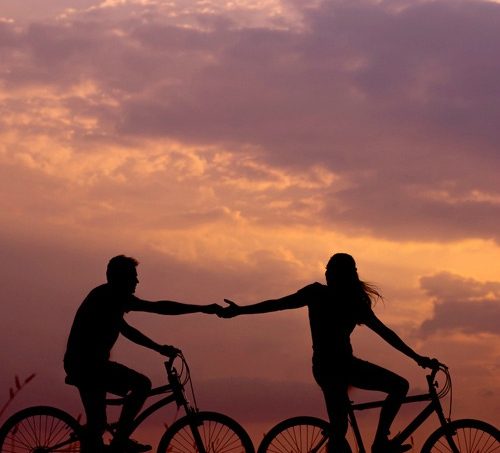 couple biking