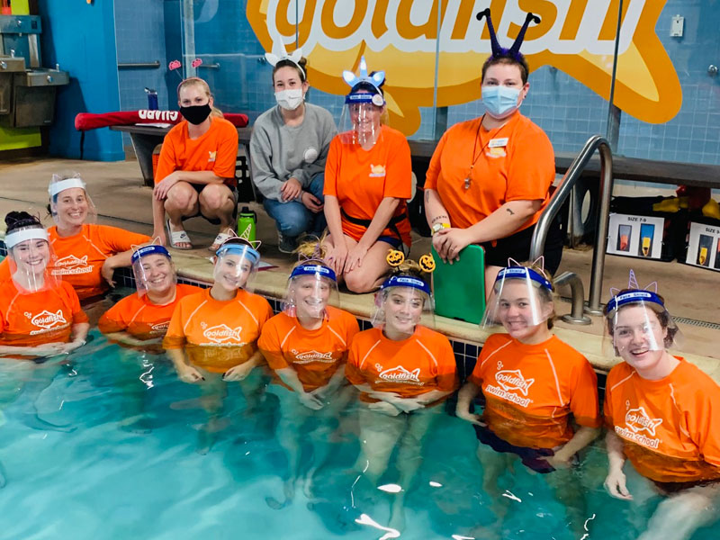 Goldfish Swim School staff by pool