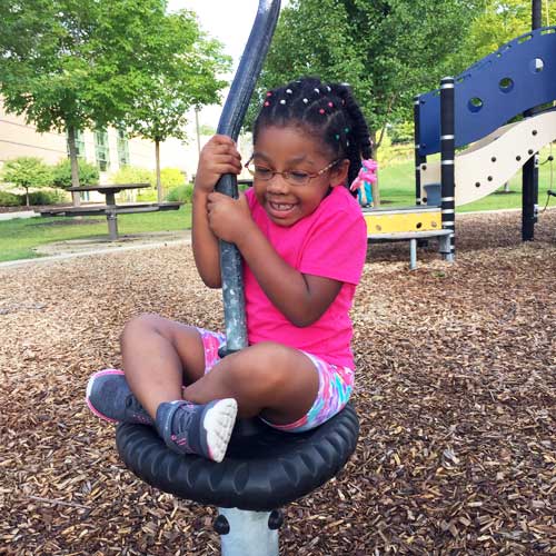 Kroc Center camp girl on playground