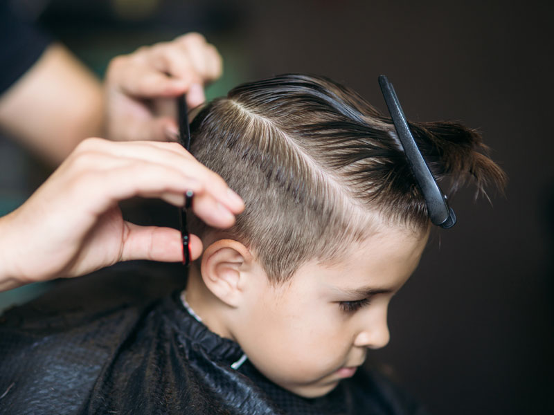 kids haircuts boy in salon chair