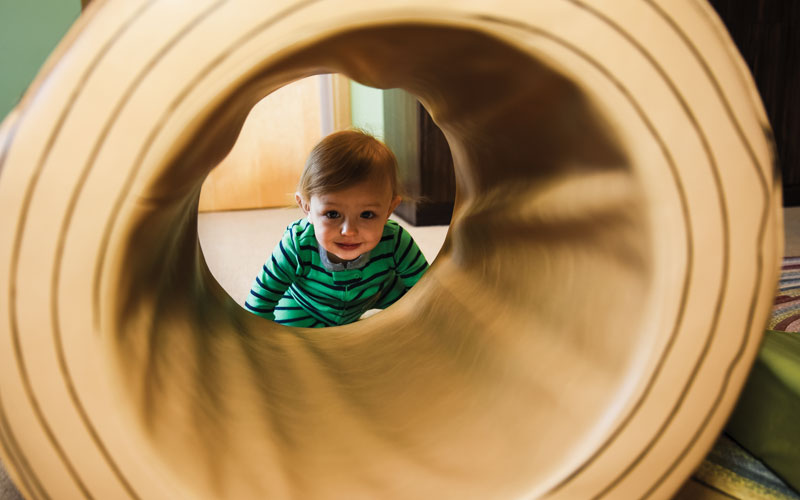Appletree boy playing in tunnel