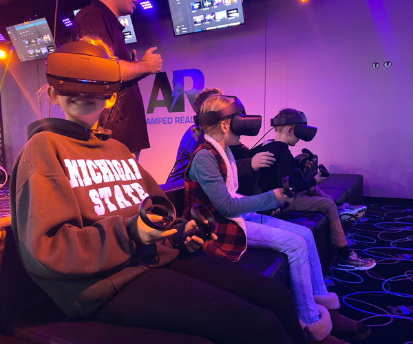 Amped Reality kids sitting smiling Hunt