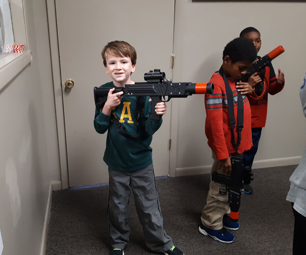 boy excited for laser tag