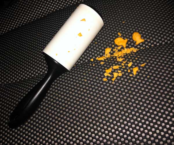 lint roller cleaning up crushed goldfish crackers