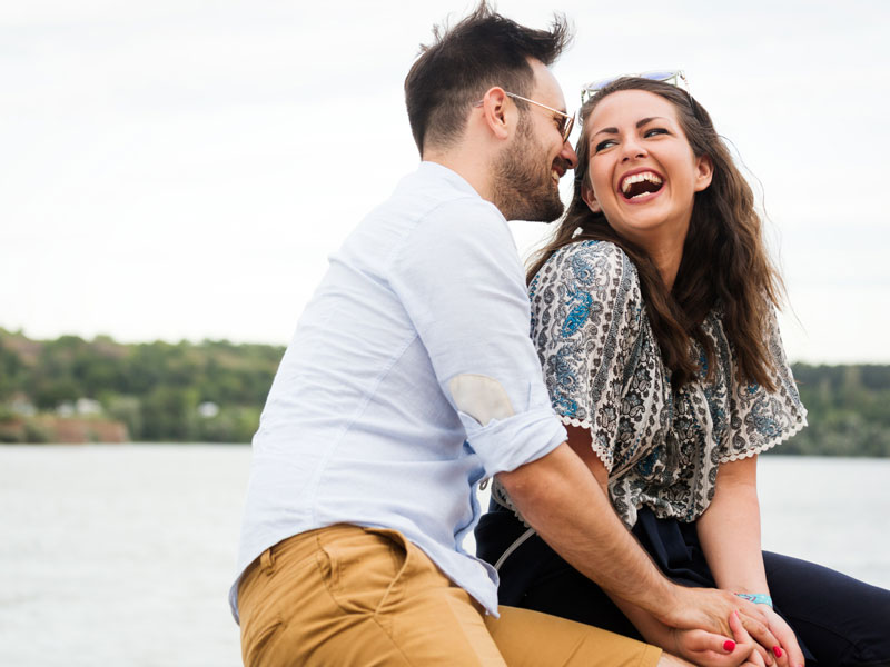 Grand Rapids Date Night Ideas couple on the lake laughing