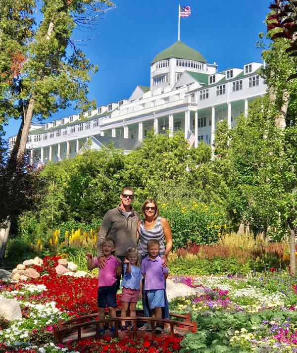 Family in beautiful gardens at Grand Hotel on Mackinac Island