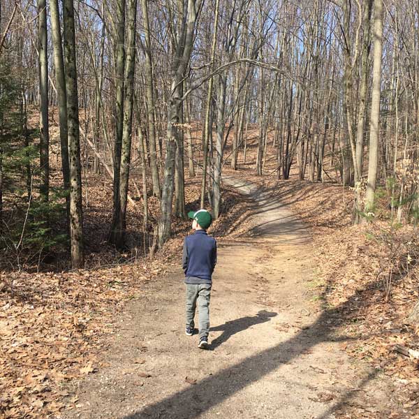 Pigeon Creek trail boy walking on hill
