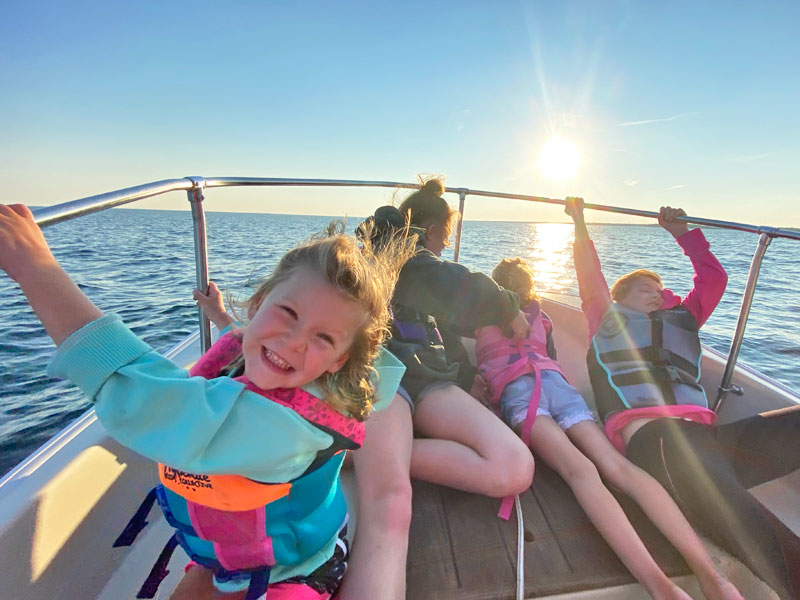 kids on a boat on lake huron