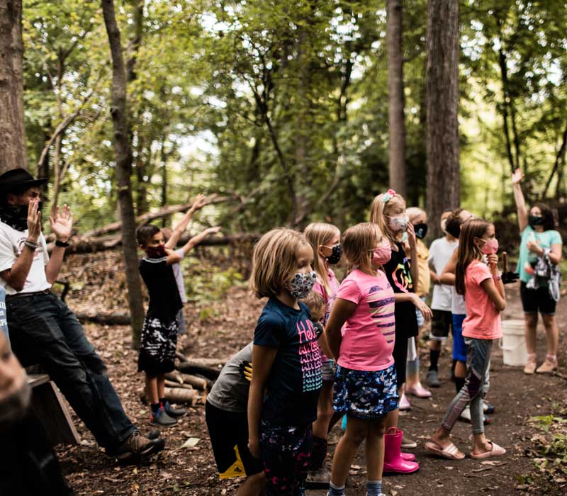 Rockford Christian School students having class in the woods