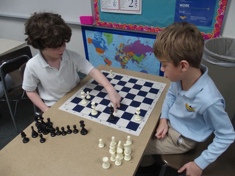 Trinitas classical school boys playing chess