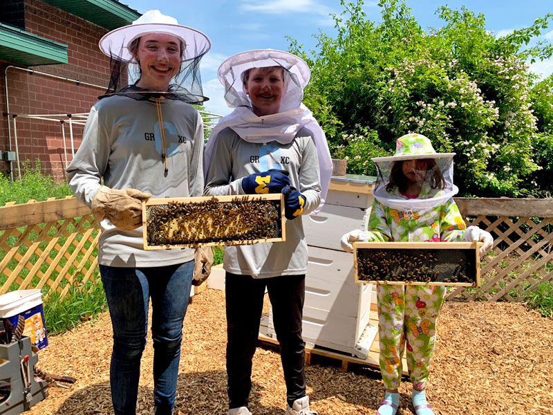 Rockford Christian GRCS apiary students smiling