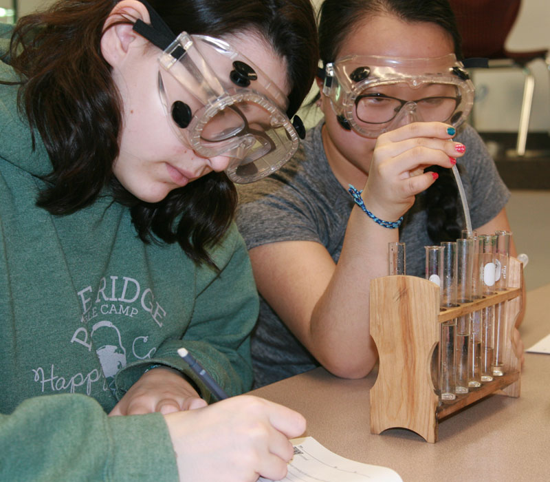 GVSU Charter School girls doing a science
