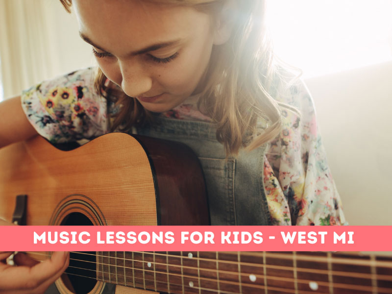 Girl taking piano lessons. Kids can take guitar lessons, singing lessons and more in Grand Rapids.