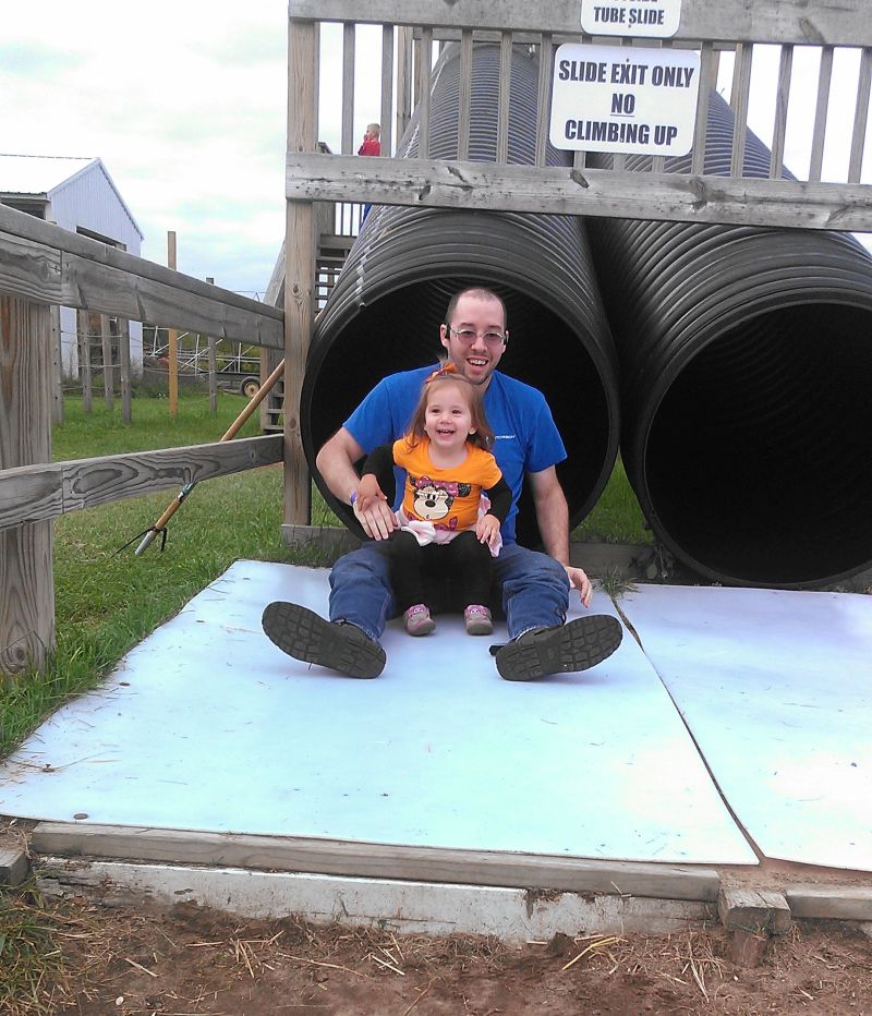 Post Family Farm dad and girl at bottom of tube slide Rudd