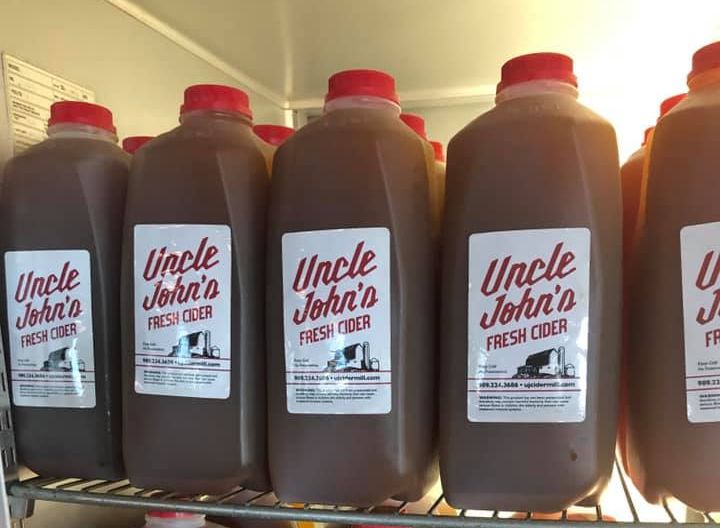 Uncle Johns Cider Mill apple cider in cooler