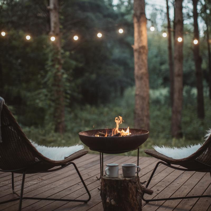 Firepit and chairs are at some Glamping Michigan Places