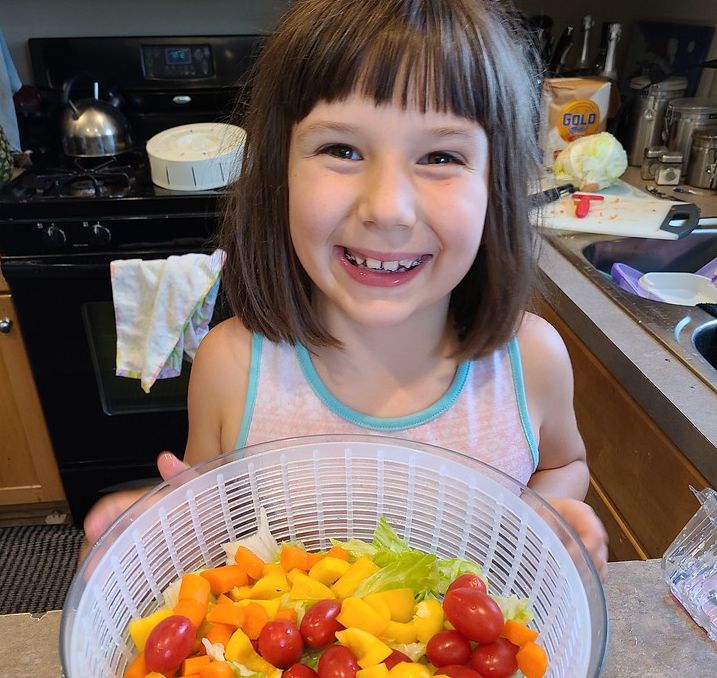 Kids Cook Real Food girl with colorful salad
