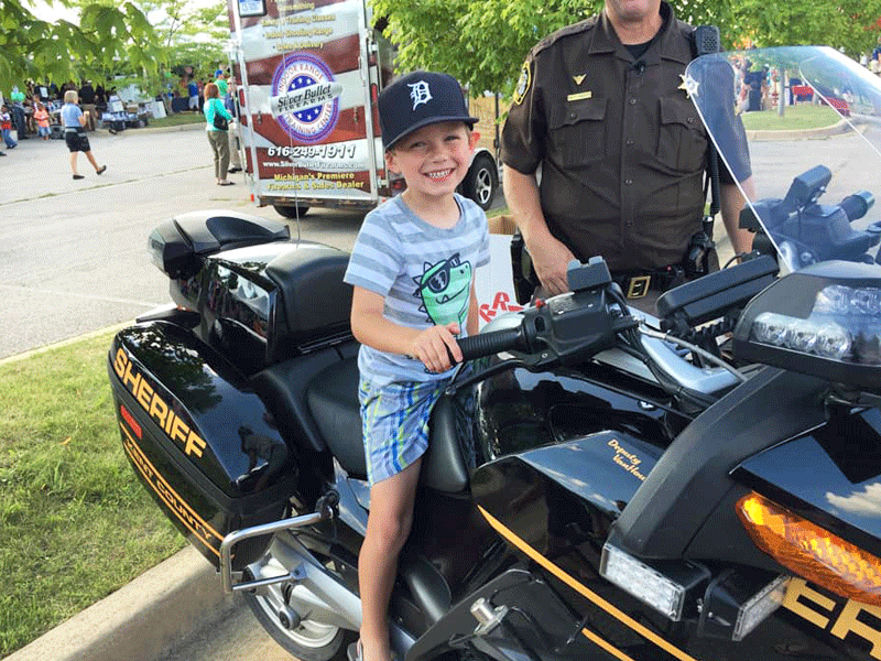 National Night Out boy on motorcycle Guider