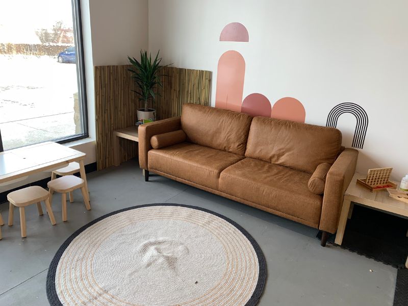 Coffee Clubhouse couch and mural
