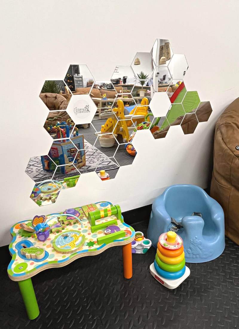 Coffee Clubhouse baby play area with hexagon mirrors