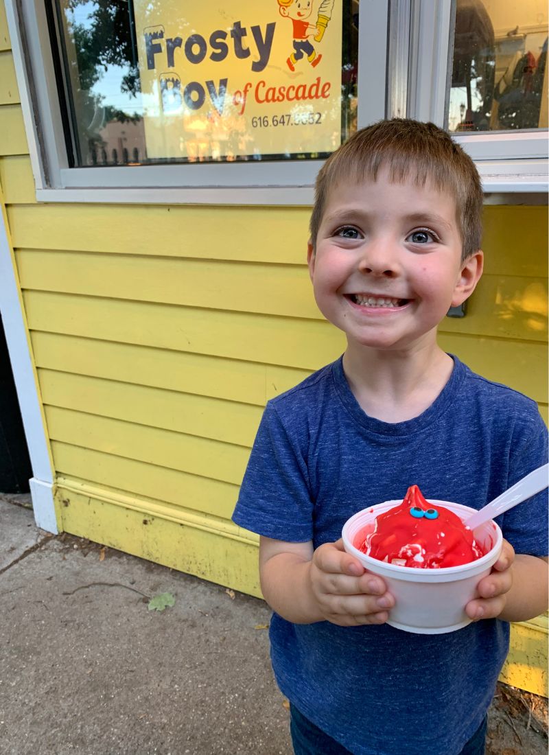 Boy with red ice cream frosty boy cascade - Austin
