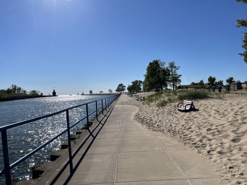 Holland State Park paved walkway by coastline