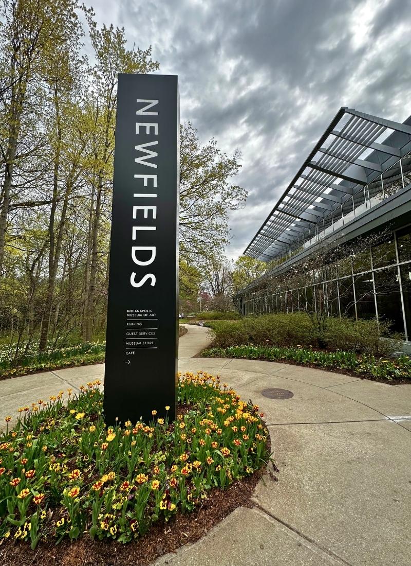 Newfields Sign in Garden at LUME Indianapolis Art Museum