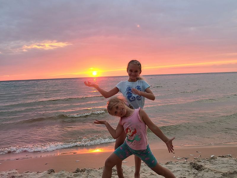 Lake Michigan Camp girls on beach at sunset