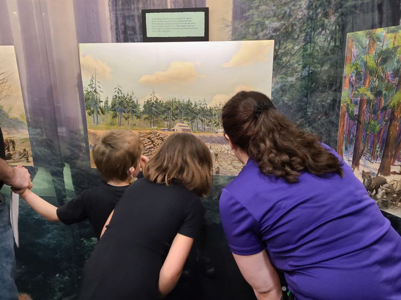 Lakeshore Museum Muskegon group looking at painting