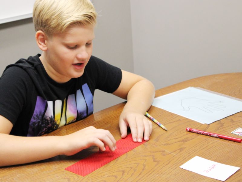 SLD Read boy working with manipulatives