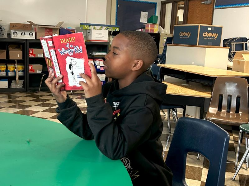 SLD Read student reading book