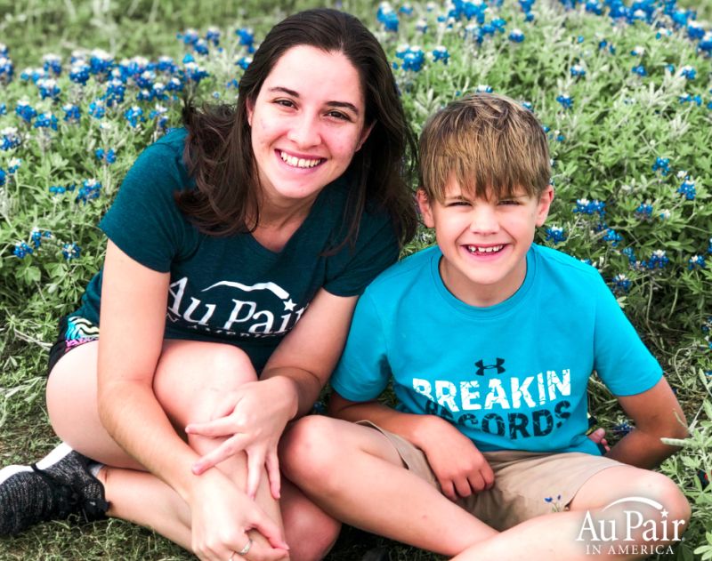 Au Pair in America boy and au pair in garden