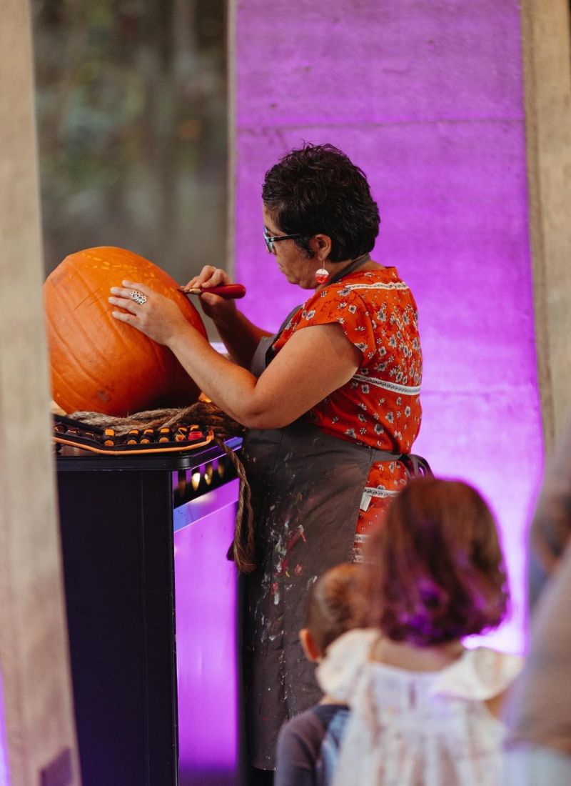 Alynn Guerra in action etching pumpkin
