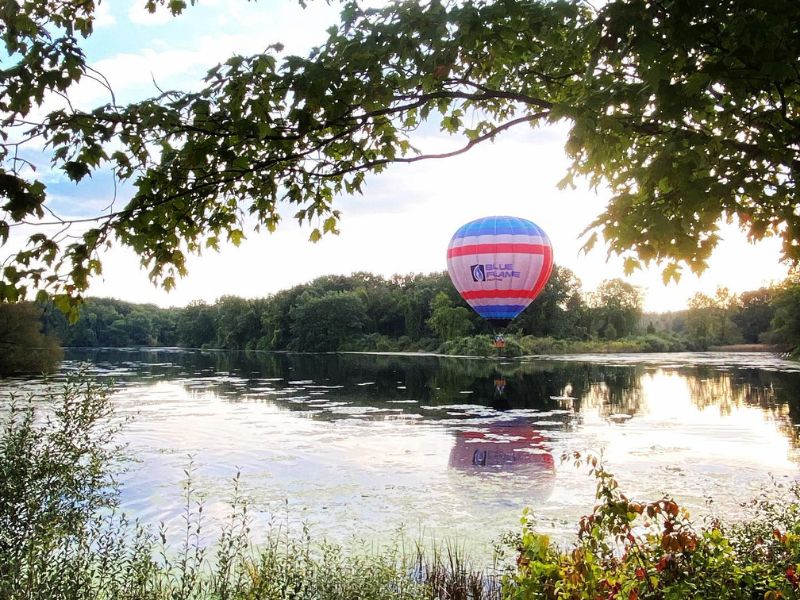 Majestic Adventures balloon at lake during sunset