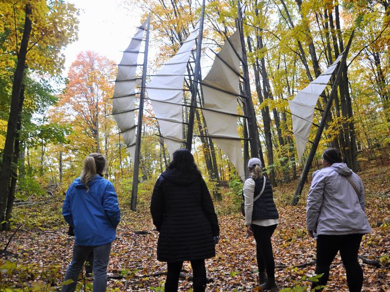 Michigan Legacy Art Park, hikers viewing 5 points art installation