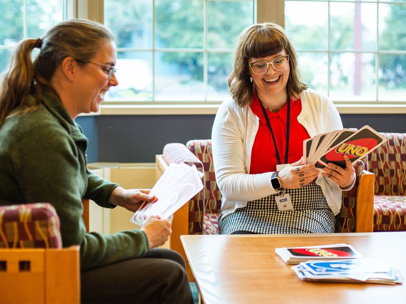 Two women play board games at Grand Rapids Library community game night.