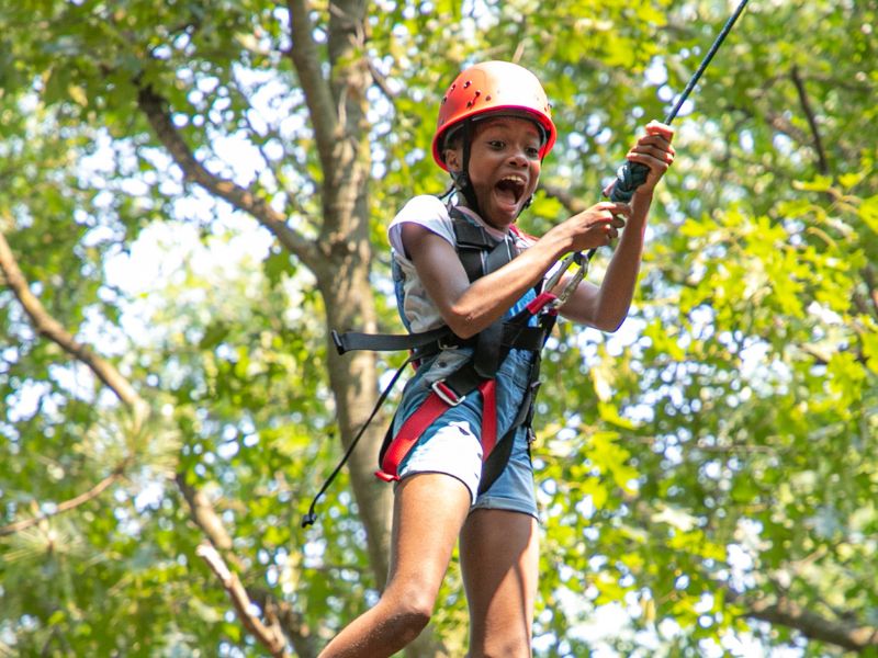Grace Adventures summer camp 2024 excited boy on zipline