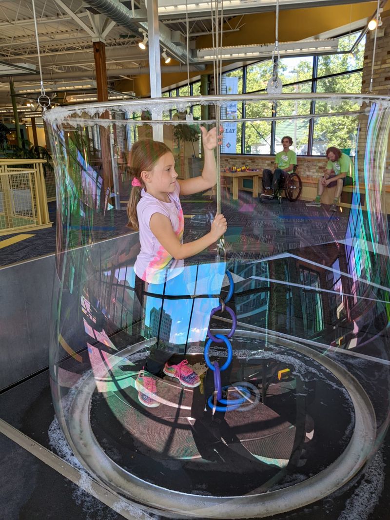 Grand Rapids Childrens Museum girl inside of bubble