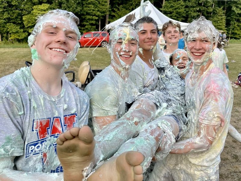 Grace Outside summer camp 2024 boys covered in shaving cream