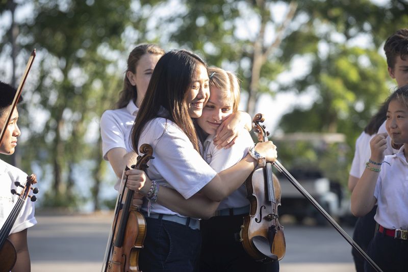 Interlochen summer camp 2025 violinists hugging