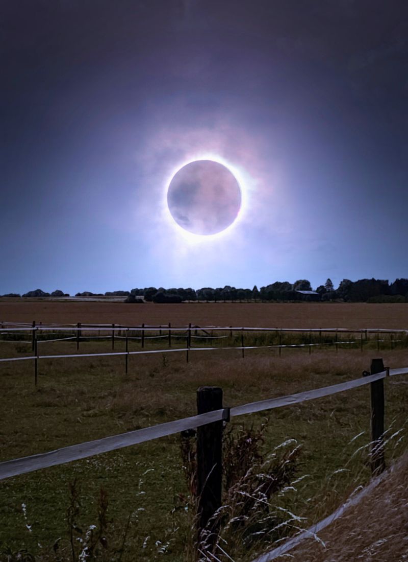 Solar Eclipse over field - photo credit Rolf Wittke Canva